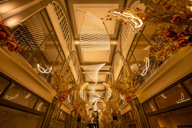 London, UK - Nov 20 2023: Quadrant Arcade, a chic retail complex with upscale shops adjoining Regent Street in central London. Seen with illuminations and Christmas decorations.