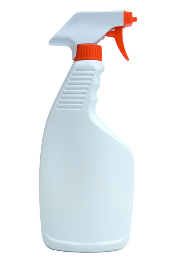 An orange spray bottle with clipping path.