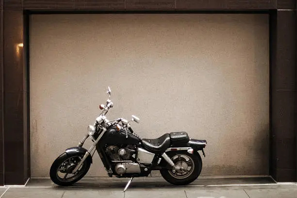 Motorcycle framed by architectural detail; lotsa room for copy.