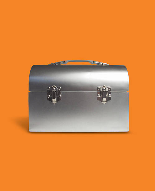 The Lunchbox Cool luchbox on a orange background. Contrast is very good so it would be very easy to change color or tone to fit your style. latch photos stock pictures, royalty-free photos & images