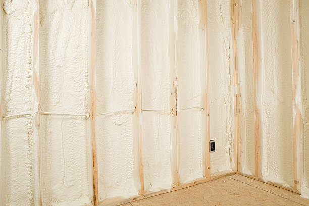 New Home Construction Walls Sprayed with Expandable Foam Insulation  spray insulation stock pictures, royalty-free photos & images