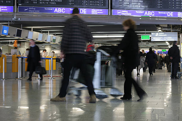 istock Airport life - passengers walking by 182660914