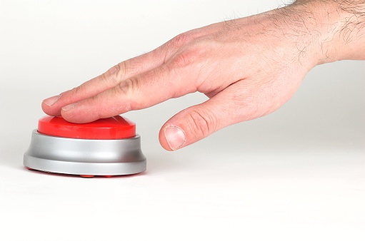 pushing a big red button
