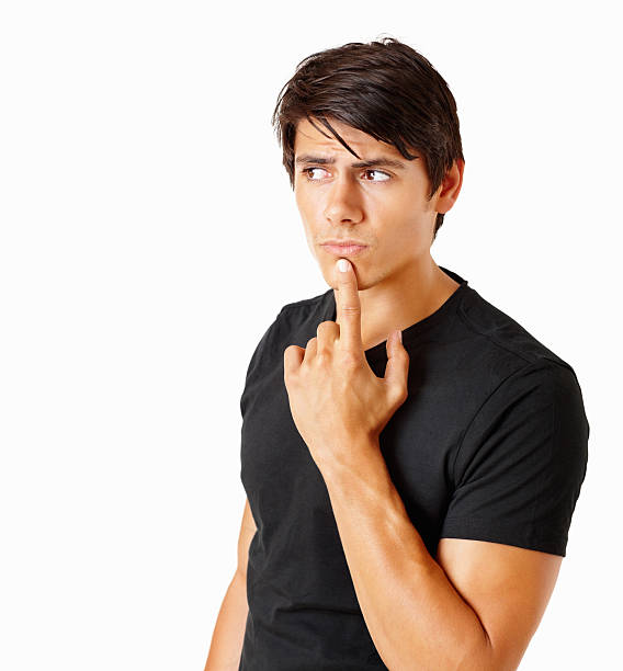istock Handsome thoughtful young man looking away on white 182661055