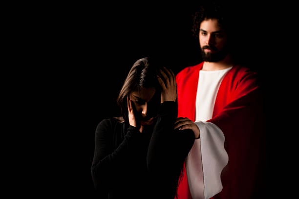 istock Worried woman with Jesus touching her shoulder 182661340
