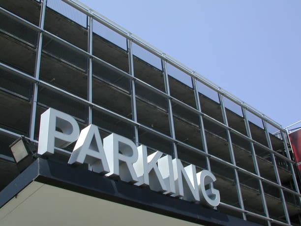 istock Four level parking garage with a sign at entrance 182661382