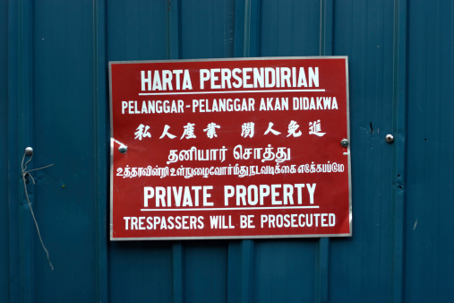 The Rosetta stone of private property signs!Found in Malacca (Melaka) Malaysia