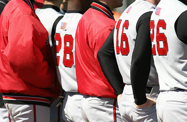 istock Backs of baseball players in a line 182661617