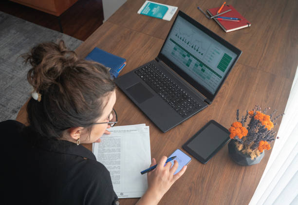 istock Adult woman working at home (laptop, document, telephone).E-learning concept. Online classes 1826617979