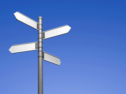 Blank signpost with four arrows over clear blue sky - just add your text.Precise clipping path included for easy background change.