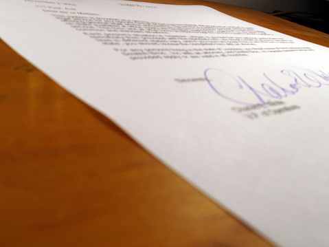 Contract/legal agreement (out-of-focus)<b>*Note: the verbiage in this document is completely fictitious</b>