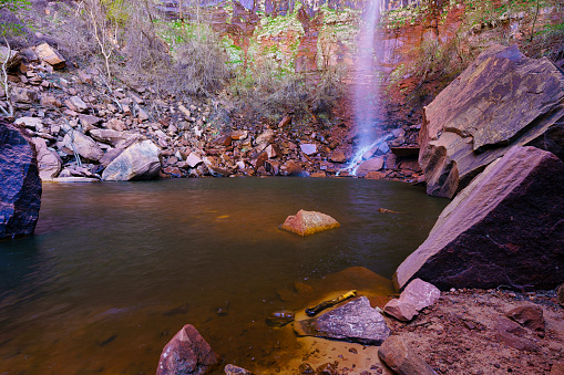 Desert Waterfall in Scenic Red Rock Canyon - Emerald pools and waterfall during spring. Scenic waterfall landscape.