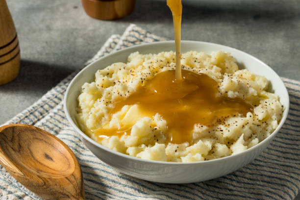istock Homemade Turkey Gravy and Mashed Potatoes 1826627857