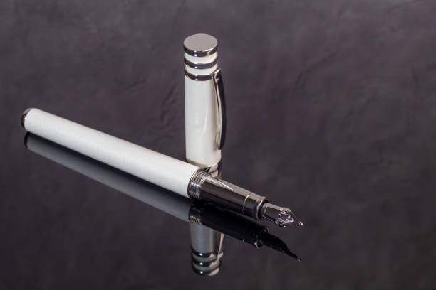 istock Fountain pen on marble and gray background. Gift concept. 1826630583
