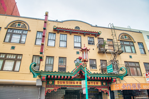 San Francisco, California, USA - December 15, 2018: Tourists visitors and residents at the historic Dragon Gate Arch South Chinatown entrance in San Francisco, California, USA.