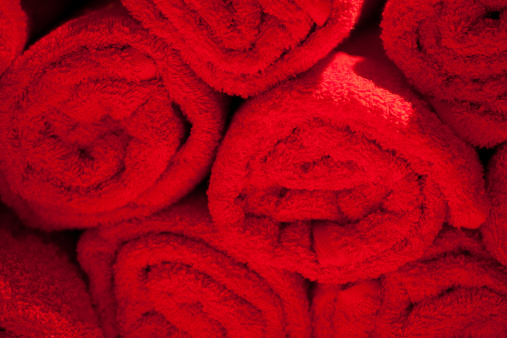 Red towels bundled together.