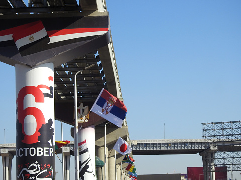 Cairo, Egypt, November 30 2023: Flags of various and different countries of the world at the Cairo monorail site, waving flags of different countries for participation in a  conference in Egypt, selective focus