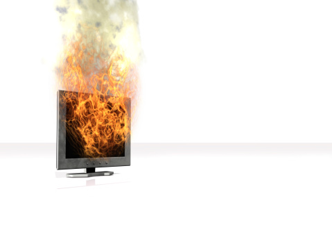 Flat screen montitor in flames. 3D render.Black background version here: