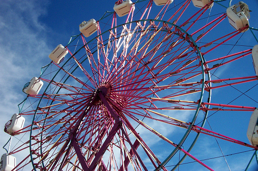 A ferris wheel ride at the fairgrounds.