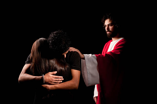 Young and sad couple with Jesus by their side
