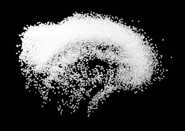 istock White coarse sea salt isolated on a black background. 1826643756