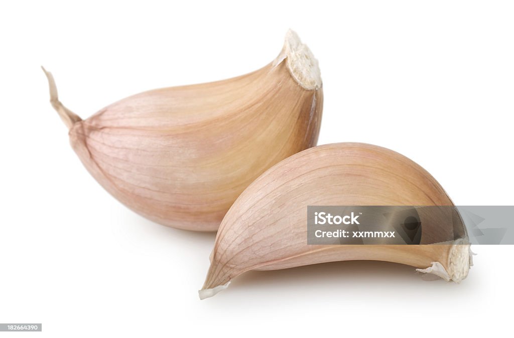 Garlic Garlic cloves on white. This file includes Garlic Stock Photo