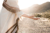 istock Person depicting Jesus and reaching hand out 182664415