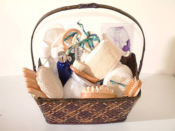 A gift basket of spa essentials Basket of bath items loofah photos stock pictures, royalty-free photos & images