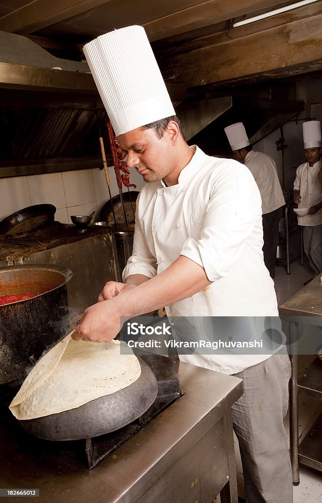 Indian Chef preparing Rumali Roti "AA AYA AA AA AA AYa AA AYa A AYa (in Hindi) is a thin bread from the northern part of the Indian subcontinent and a traditional element in Mughlai cuisine. The word rumal means handkerchief in Urdu and Hindi, and the name rumali roti means handkerchief bread. The extreme thinness of the bread and the fact that it is usually served folded like a handkerchief are the probable sources of the name." 25-29 Years Stock Photo Indian Chef preparing Rumali Roti "AA AYA AA AA AA AYa AA AYa A AYa (in Hindi) is a thin bread from the northern part of the Indian subcontinent and a traditional element in Mughlai cuisine. The word rumal means handkerchief in Urdu and Hindi, and the name rumali roti means handkerchief bread. The extreme thinness of the bread and the fact that it is usually served folded like a handkerchief are the probable sources of the name." 25-29 Years Stock Photo