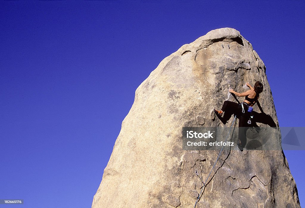 Rock Climber "Female Rock Climber on a pinnacle of rock, Apple Valley, CaliforniaMore images:" Achievement Stock Photo