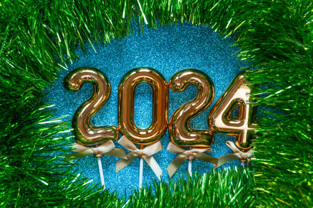 istock New Year 2024 - Orange old gold numbers on on glitter background 1826657039