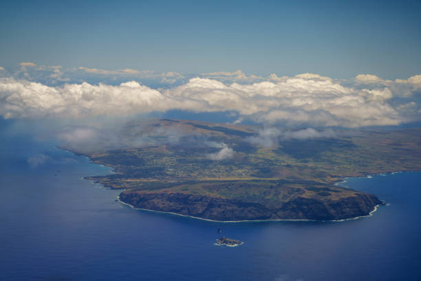 A plane arrived at Easter Island, looking at Easter Island from the plane