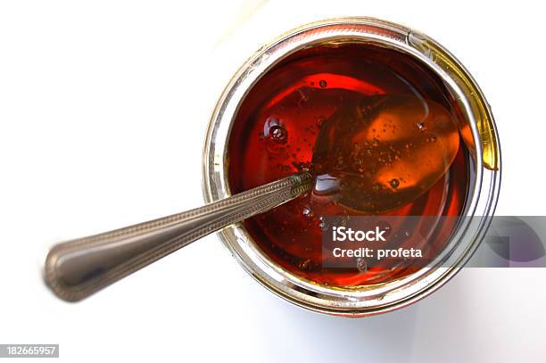 Isolated Image Of A Spoon Inside A Jar Of Syrup Stock Photo - Download Image Now - Syrup, Can, Sugar - Food