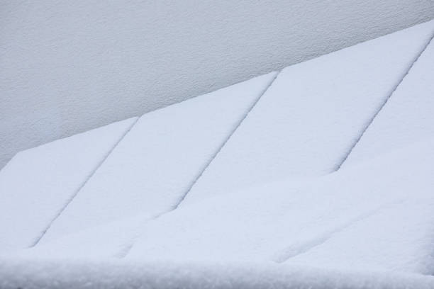 Snow-Covered Solar Panels on a Garage: Winter-Proof Renewable Energy
