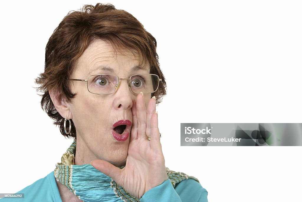 Calling Out Woman with hand to mouth calling out to someone. Copyspace on right. Active Seniors Stock Photo