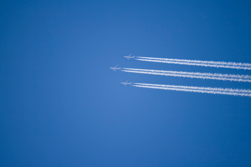 Three Airplains In A Blue Sky
