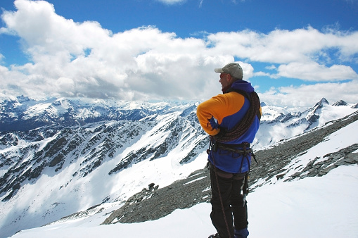 Photo of a climber enjoying a beautiful New Zealand view.