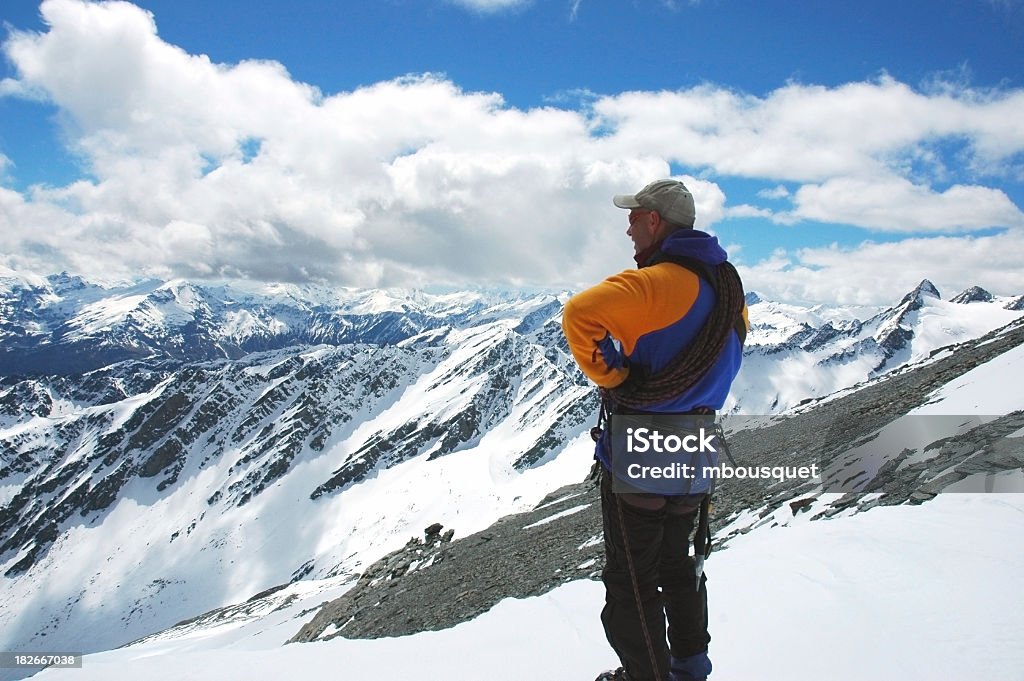 Climber Stopping for the View Photo of a climber enjoying a beautiful New Zealand view. Alertness Stock Photo