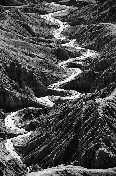 Desert Arroyo Dry river bed snaking through a desert canyon in the badlands of the Anza Borrego Desert State Park, eastern San Diego County, California. fonts point photos stock pictures, royalty-free photos & images