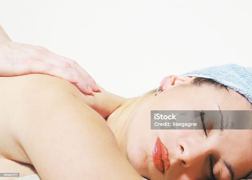 Massage 02 Woman having a massage (voluntary little bit overexposed). Adult Stock Photo