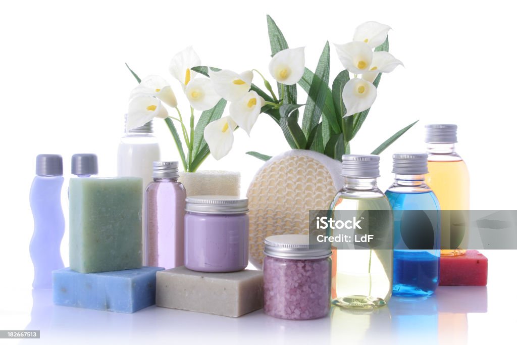 Beauty center products "Bathroom composition with natural products, liquid soap, natural soap and flowers." Grooming Product Stock Photo