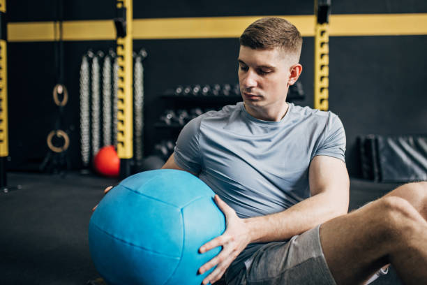 istock Man training with medicine ball 1826678610
