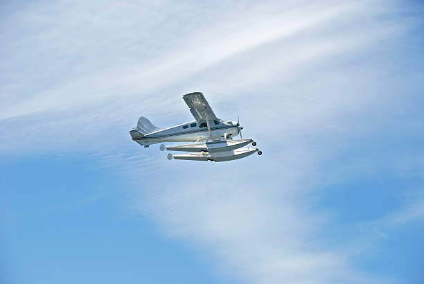 istock Seaplane Airplane in flight with light cloud background 182668516