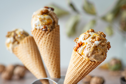 food, ice cream, gelato, walnut ice cream in a waffle cone, three objects
