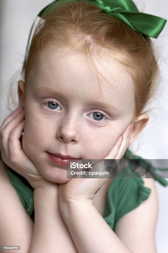 Pretty Girl in Green A little red-haired girl is pretty with her green bow Green Color Stock Photo