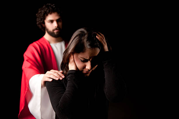 istock Worried woman with Jesus behind her 182668980