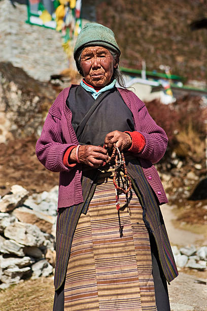 istock Nepali woman with rosary 182669131