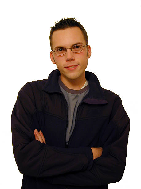 A casual young man with his arms crossed isolated on white.NOTE: I only recommend this image for applications where the final production size is not too large.     Other related photos: