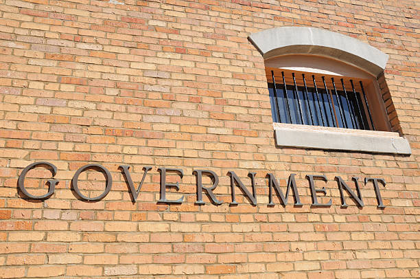 istock Gorvenment sign with barred window 182669307