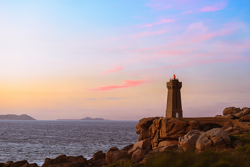 Ploumanach lighthouse at sunset, Brittany France